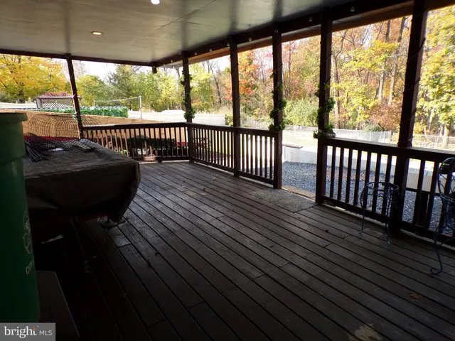 a view of a two chairs in the balcony