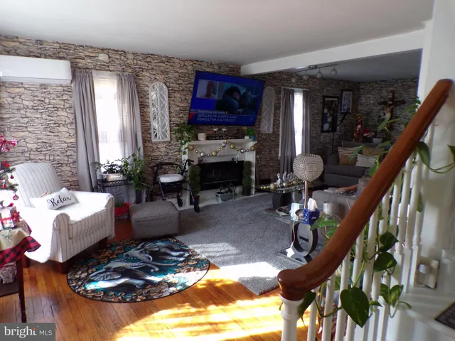 a living room with furniture fireplace and a fireplace