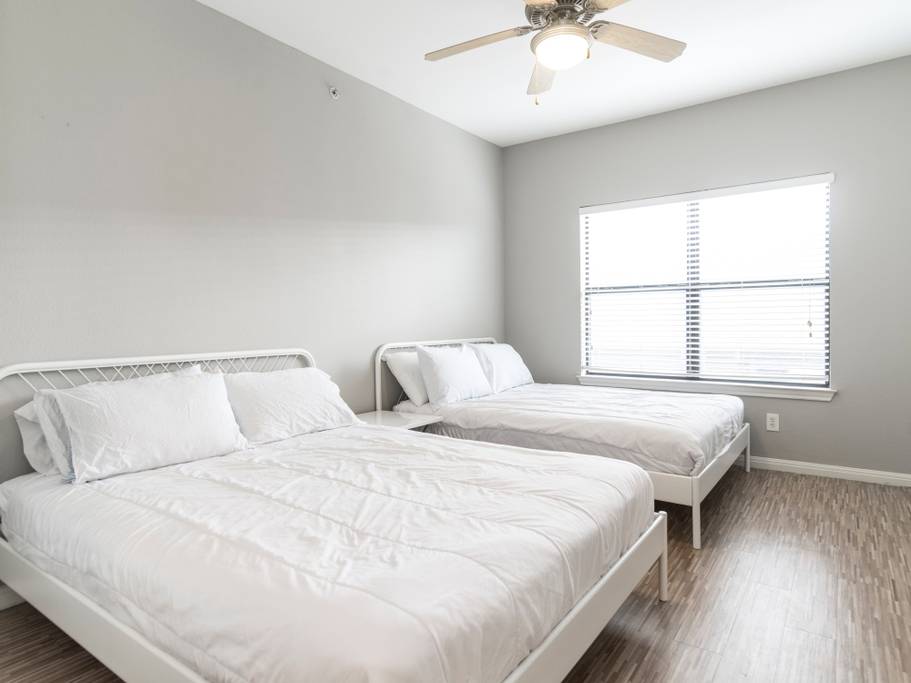 2502 Leon Street, Unit 214 Austin, TX 78705 - Photo 3 of 7 a bedroom with bed and window