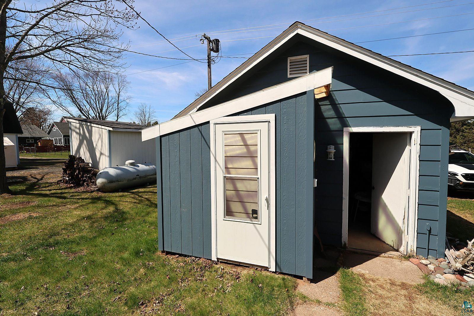 83185 Washington Avenue Port Wing, WI 54865 - Photo 5 of 26 Detached outbuilding with blue siding and white trim