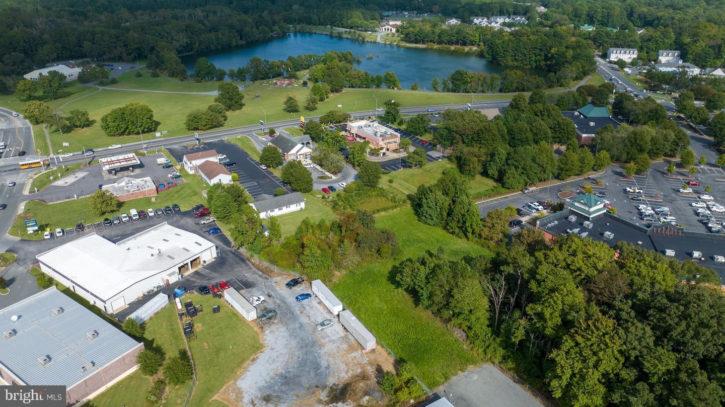 11049 Racetrack Road, Unit C Berlin, MD 21811 - Photo 5 of 8 an aerial view of a house with a yard