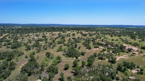 a view of a lake with a yard