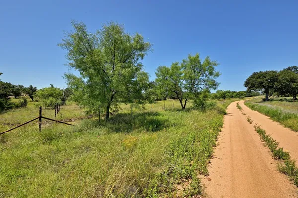 a view of lake with green space