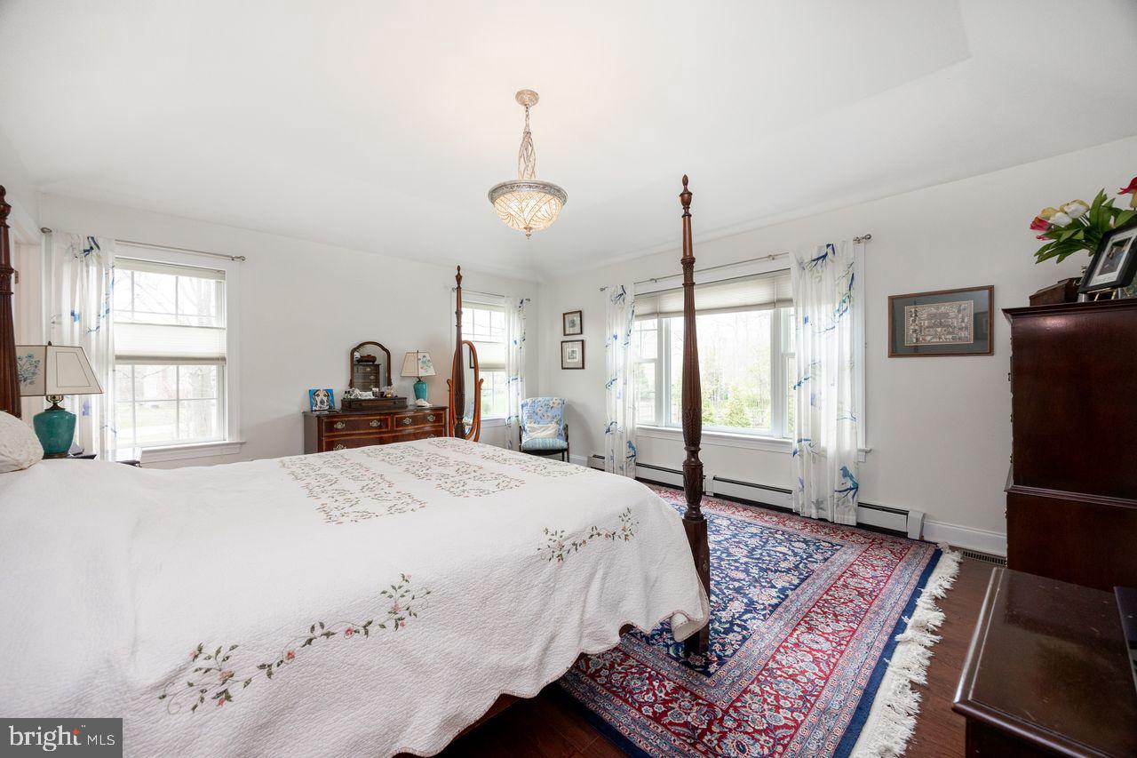 36 Long Lane Malvern, PA 19355 - Photo 20 of 44 a spacious bedroom with a bed dresser and a window