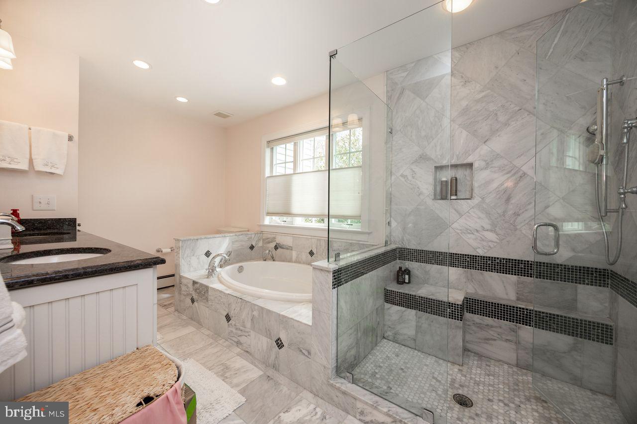 36 Long Lane Malvern, PA 19355 - Photo 23 of 44 a spacious bathroom with a tub sink and mirror