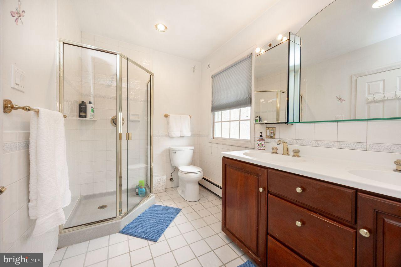 36 Long Lane Malvern, PA 19355 - Photo 28 of 44 a bathroom with a double vanity sink mirror and toilet