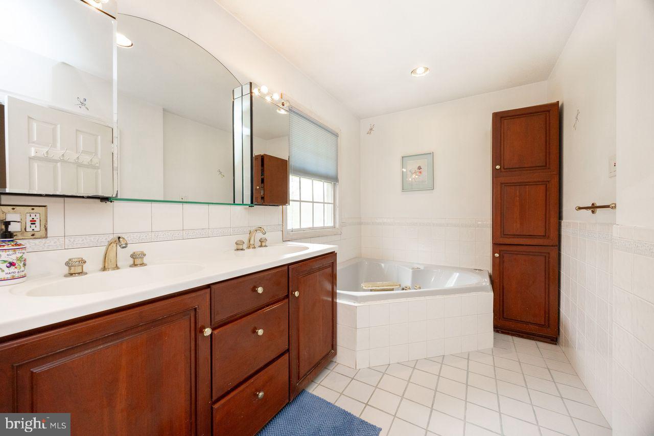 36 Long Lane Malvern, PA 19355 - Photo 29 of 44 a bathroom with a sink a toilet and tub