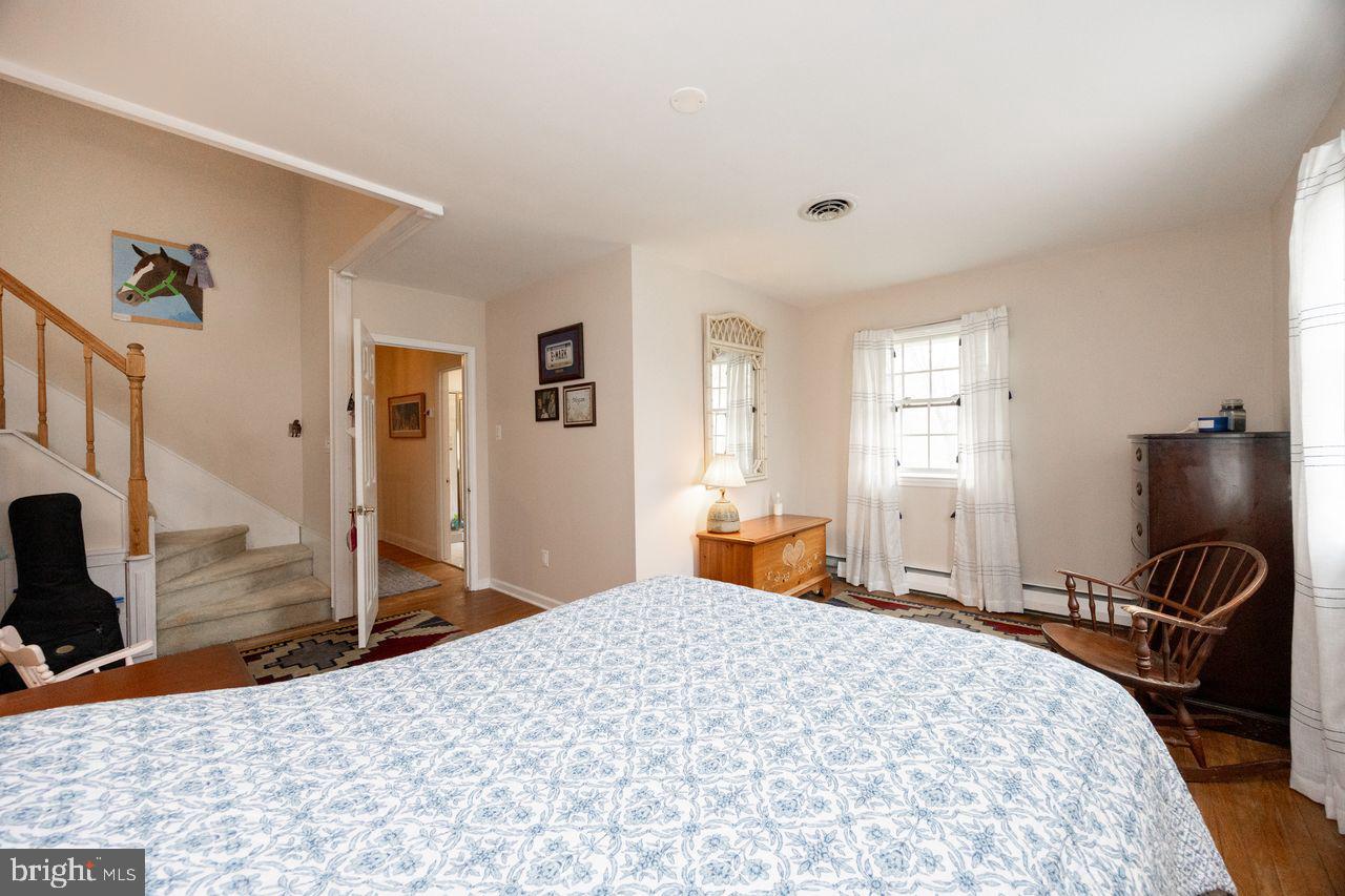 36 Long Lane Malvern, PA 19355 - Photo 30 of 44 a bedroom with a bed and wooden floor