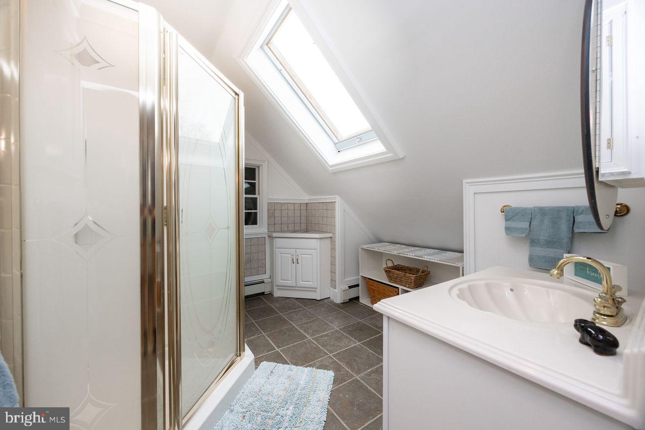 36 Long Lane Malvern, PA 19355 - Photo 32 of 44 a bathroom with a sink and a mirror