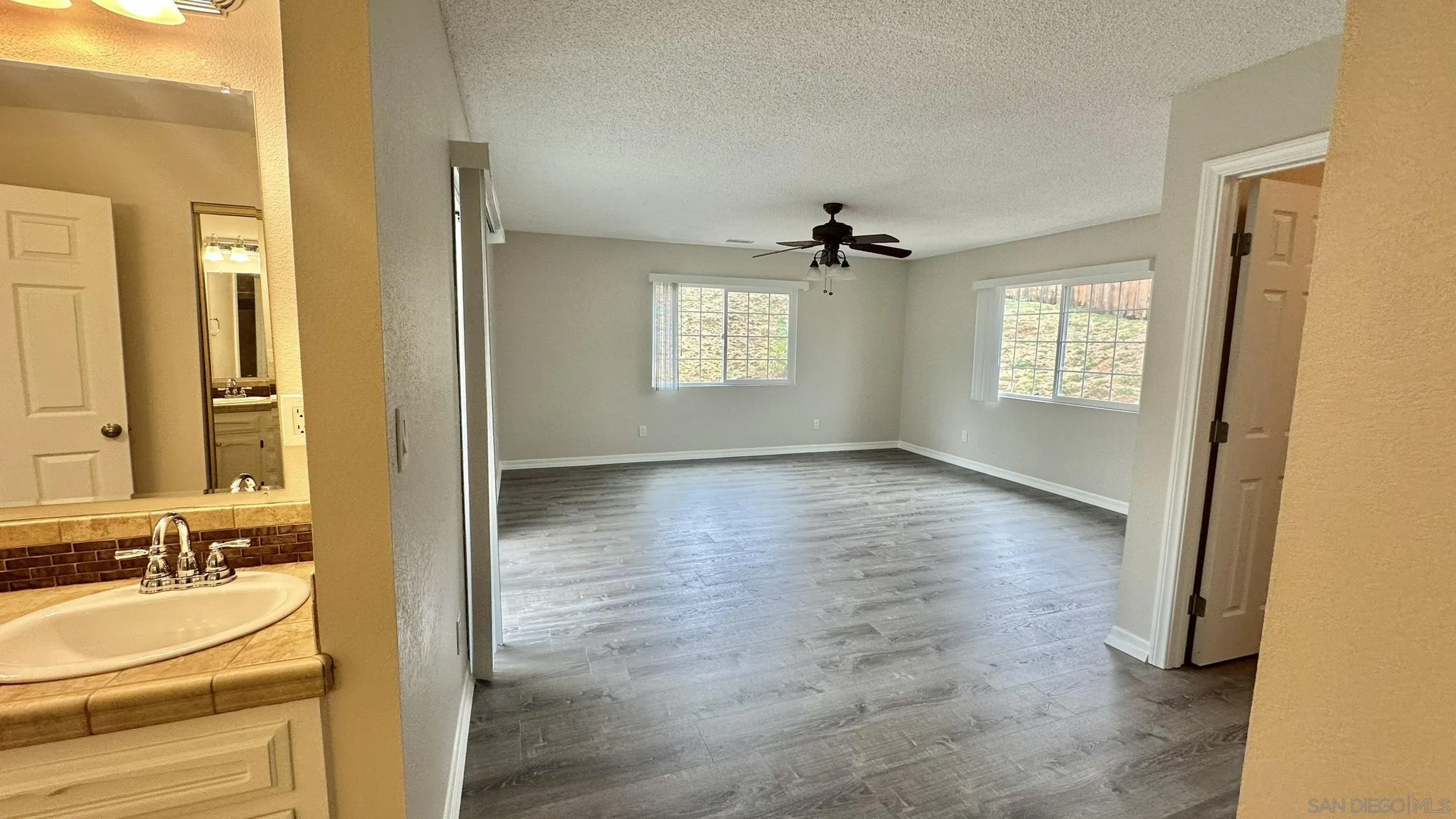 16142 Dartolo Road Ramona, CA 92065 - Photo 23 of 31 a view of an empty room with a bathroom and a sink