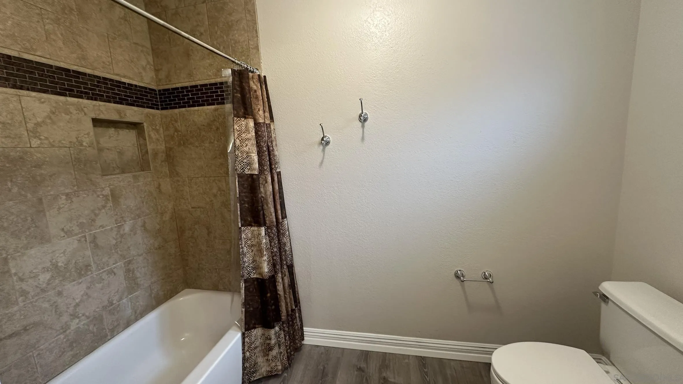 16142 Dartolo Road Ramona, CA 92065 - Photo 28 of 31 a bathroom with a toilet and a shower
