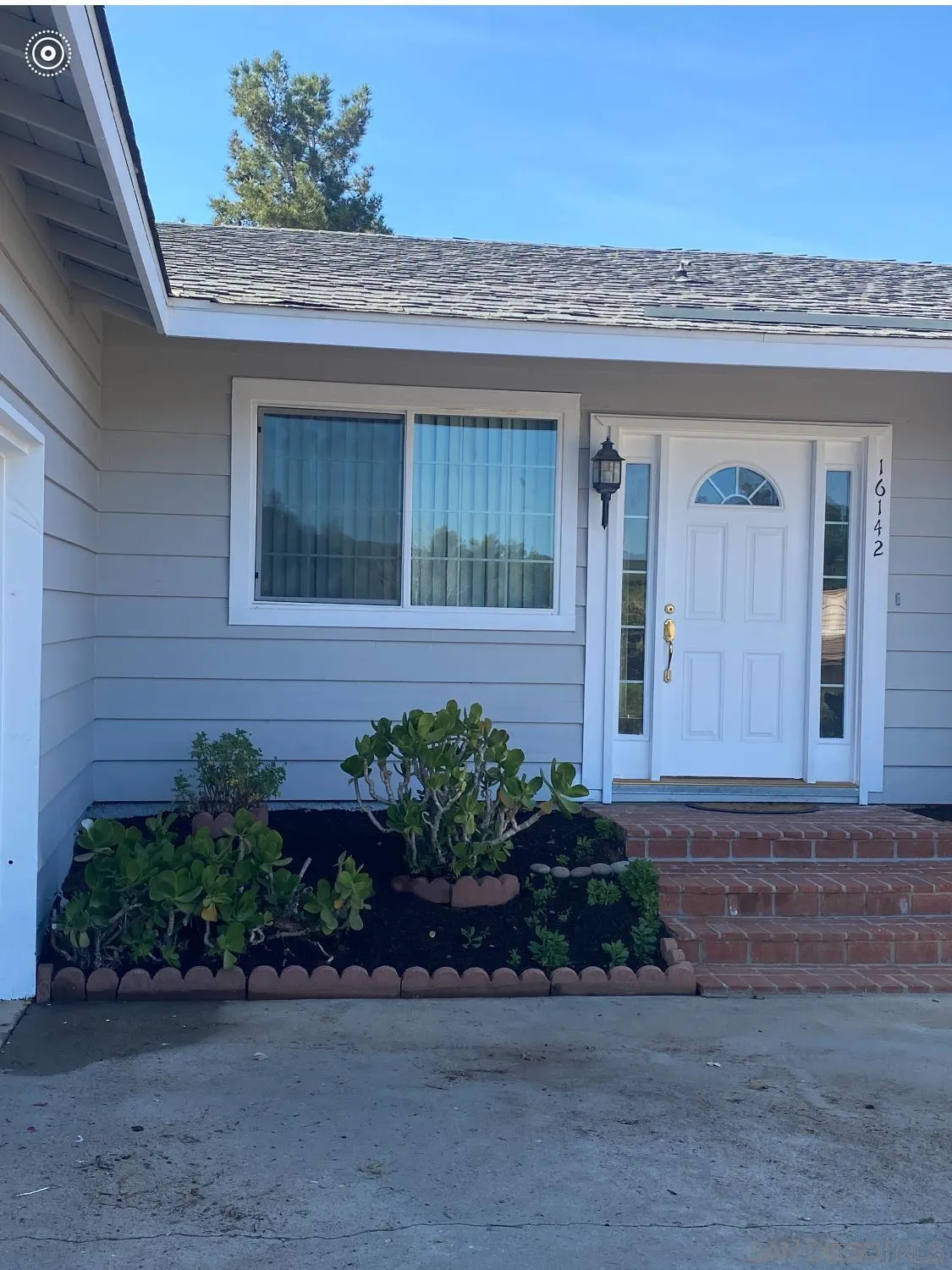 16142 Dartolo Road Ramona, CA 92065 - Photo 3 of 31 a front view of a house