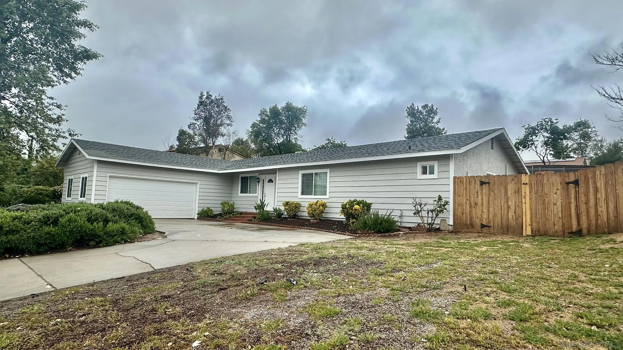 16142 Dartolo Road Ramona, CA 92065 - Photo 5 of 31 a view of backyard of house and car parked