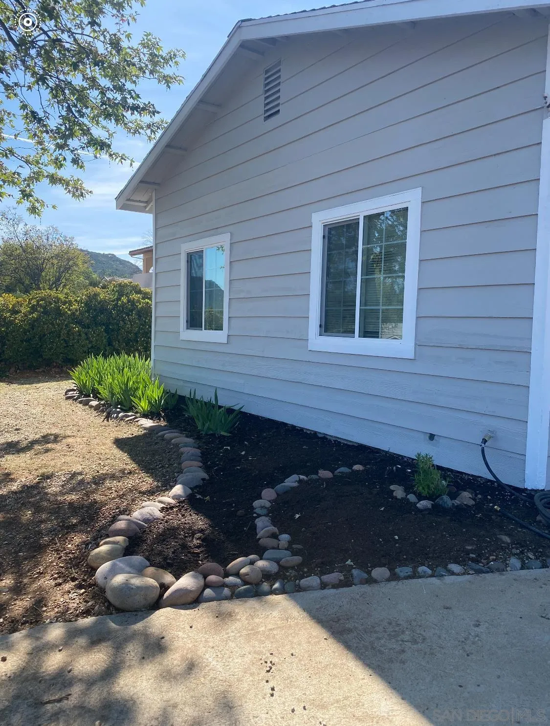 16142 Dartolo Road Ramona, CA 92065 - Photo 6 of 31 a front view of a house with a yard