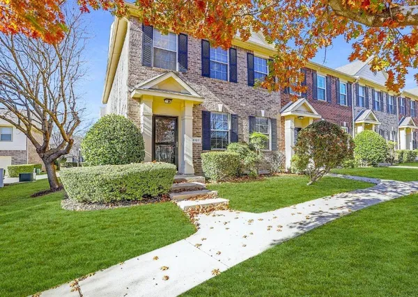 a view of a building with a garden
