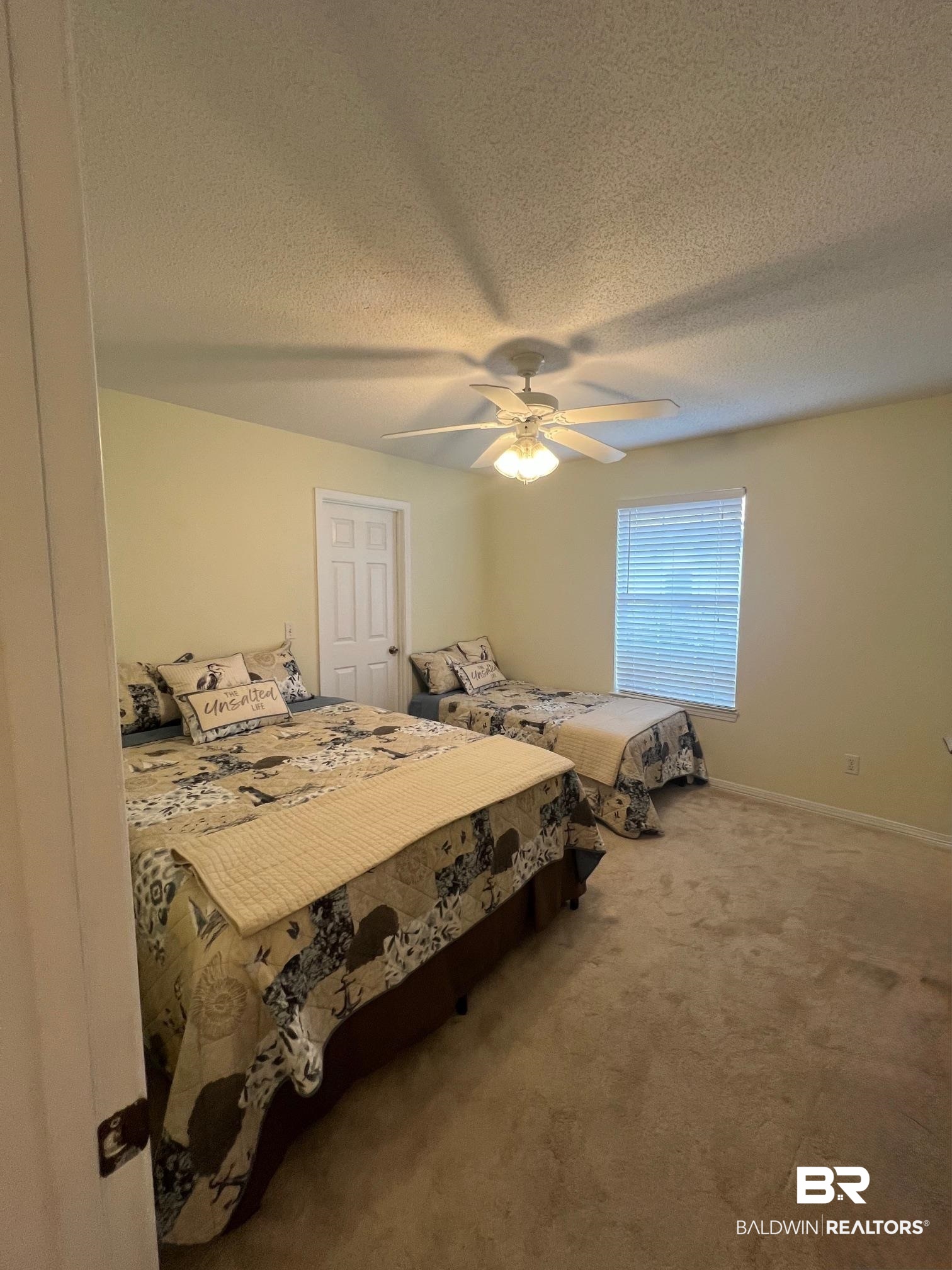 2204 Club House Drive Lillian, AL 36549 - Photo 15 of 38 Bedroom with carpet floors, a textured ceiling, and ceiling fan