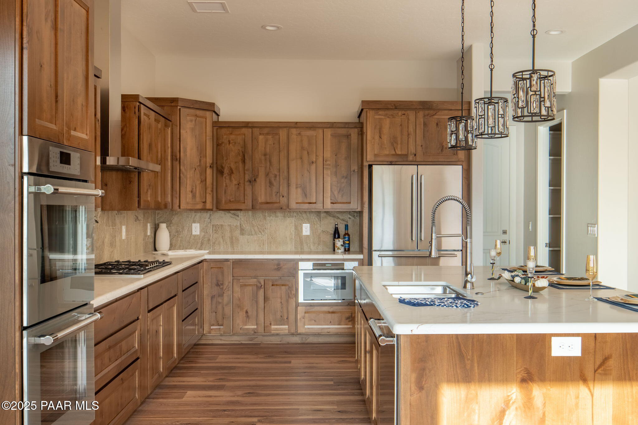 9596 North Bridle Ridge Road Prescott, AZ 86305 - Photo 19 of 58 a kitchen with stainless steel appliances a sink stove and refrigerator