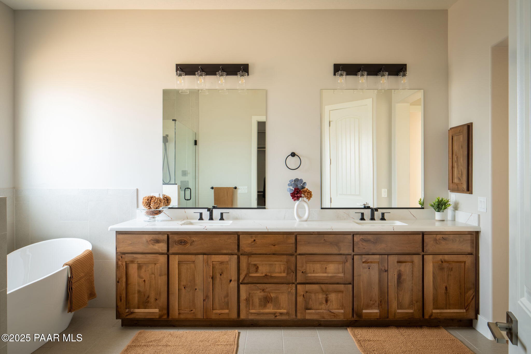 9596 North Bridle Ridge Road Prescott, AZ 86305 - Photo 30 of 58 a bathroom with a double vanity sink and a mirror