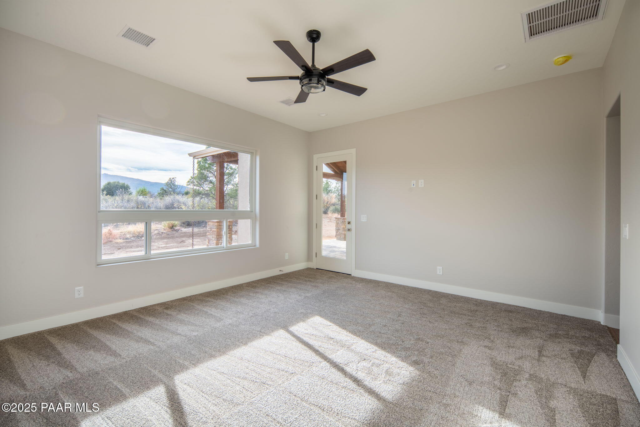 9596 North Bridle Ridge Road Prescott, AZ 86305 - Photo 34 of 58 a view of a livingroom with a ceiling fan and window