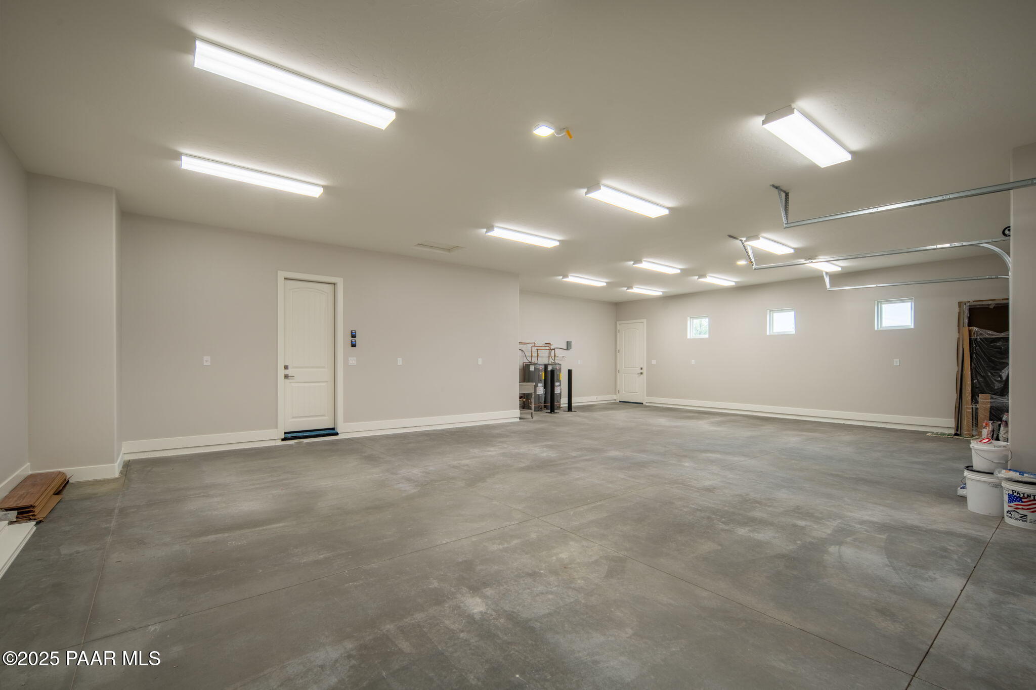 9596 North Bridle Ridge Road Prescott, AZ 86305 - Photo 42 of 58 an empty room with kitchen and chandelier fan