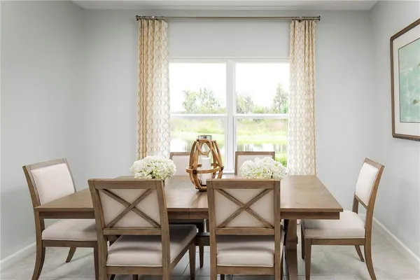 a view of a dining room with furniture window and outside view