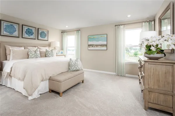 a bedroom with a bed furniture and a window