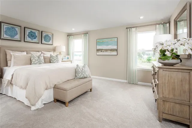 a bedroom with a bed furniture and a window