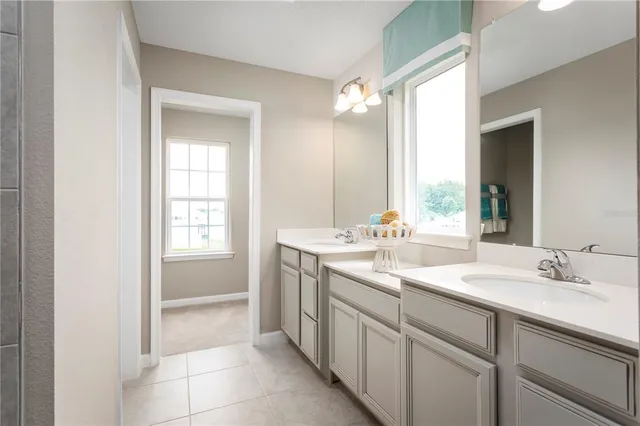 a bathroom with a sink a vanity and a mirror