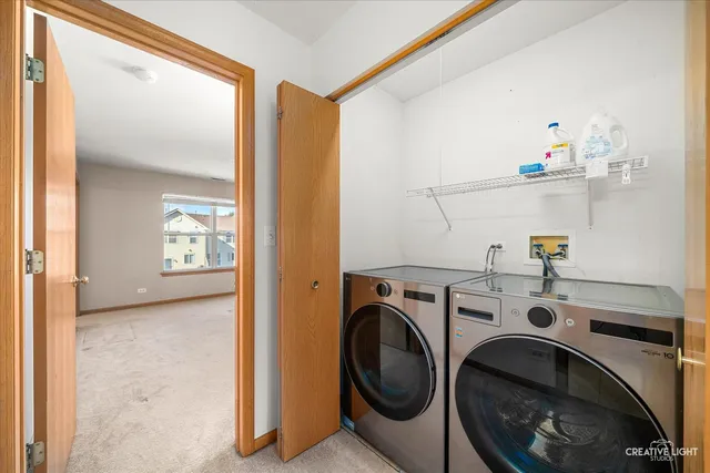 a view of washer and dryer in a utility room