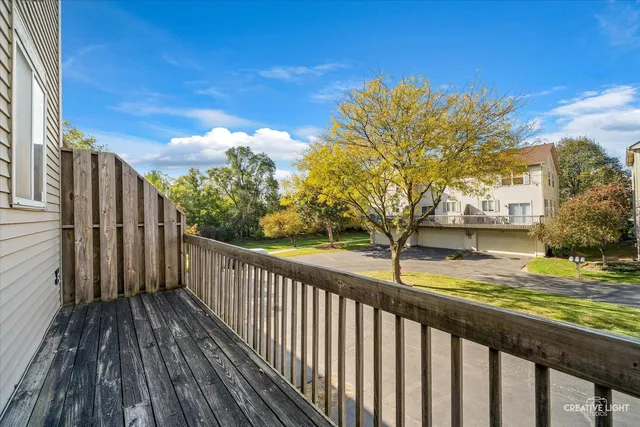 a view of a balcony with wooden floor
