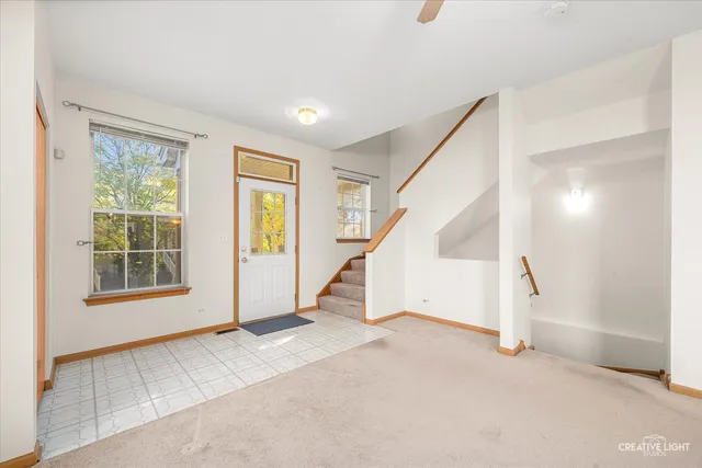 a view of an empty room with stairs