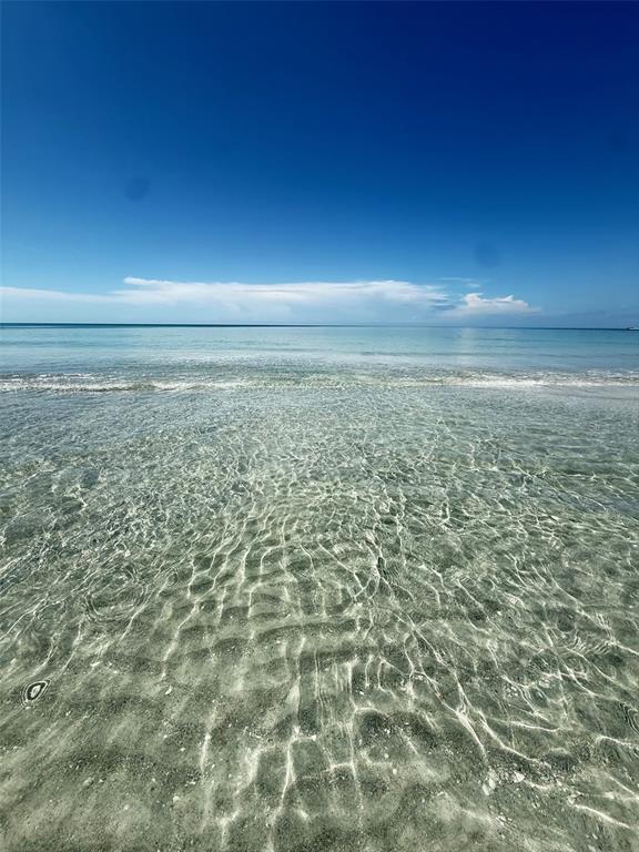 540 Neptune Avenue, Unit 7 Longboat Key, FL 34228 - Photo 11 of 12 a view of beach with an ocean