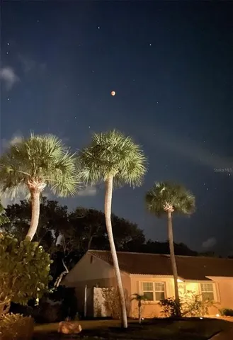 a vase of flowers sitting on a table in a room