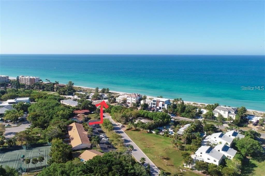 540 Neptune Avenue, Unit 7 Longboat Key, FL 34228 - Photo 4 of 12 an aerial view of ocean and residential houses with outdoor space