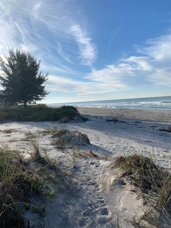 540 Neptune Avenue, Unit 7 Longboat Key, FL 34228 - Photo 8 of 12 a view of ocean view with beach