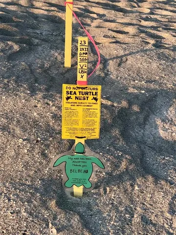 a sign that is on a brick wall