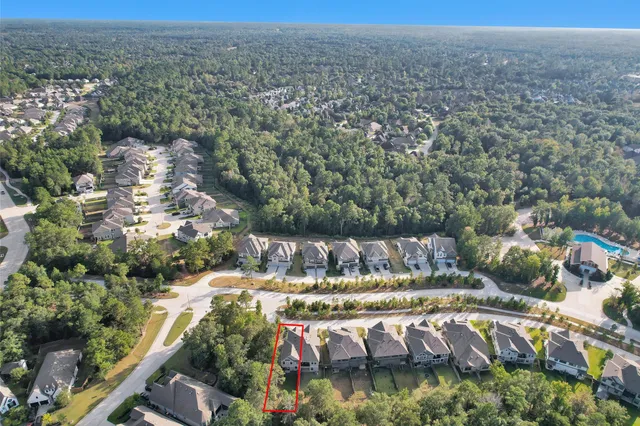 an aerial view of a house with outdoor space