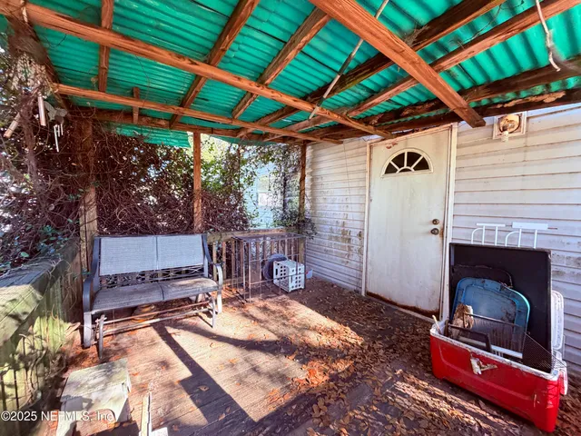 a patio with water fountain and a fireplace