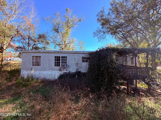 a view of a house with a garden