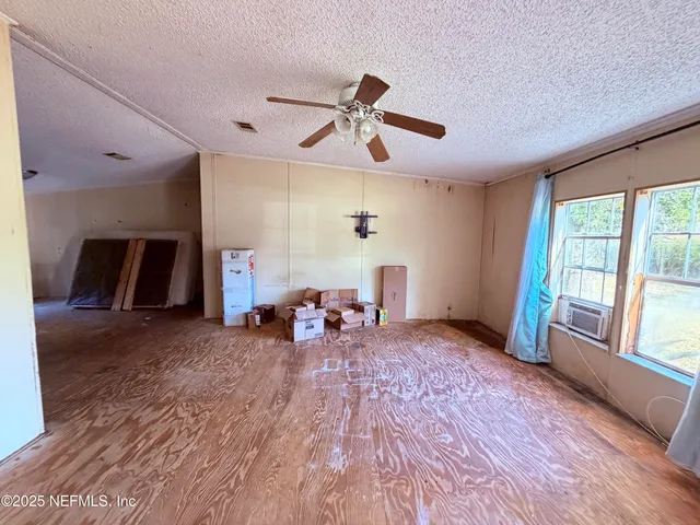 a view of a livingroom with furniture and a fireplace