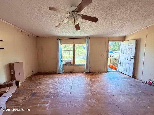 a view of a bedroom with a natural light