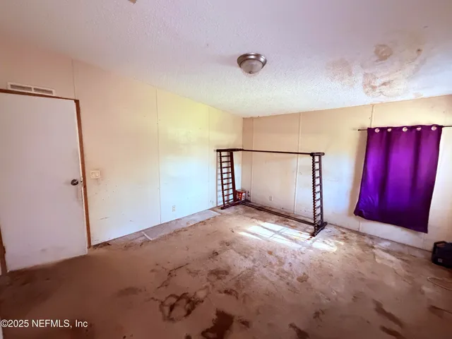 a view of a bathroom with a tub and mirror