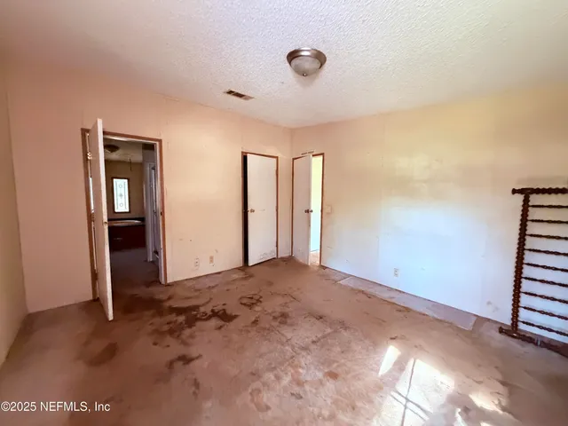 a view of kitchen and dining room with windows