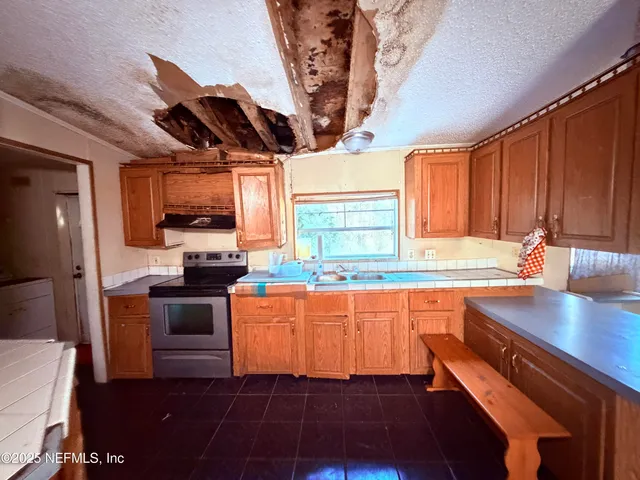 a bathroom with a sink mirror vanity and toilet