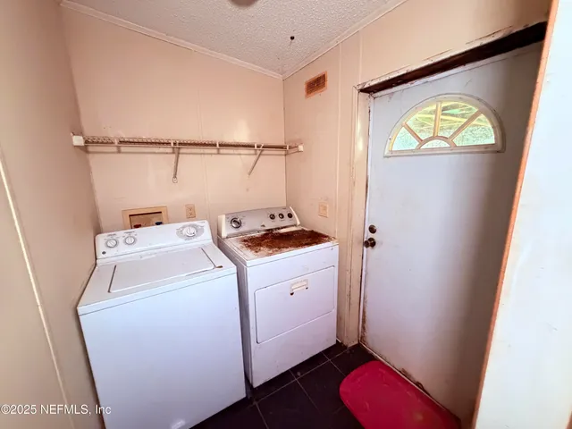 an empty room with closet and wooden floor