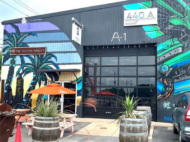 a front view of a house with yard and outdoor seating