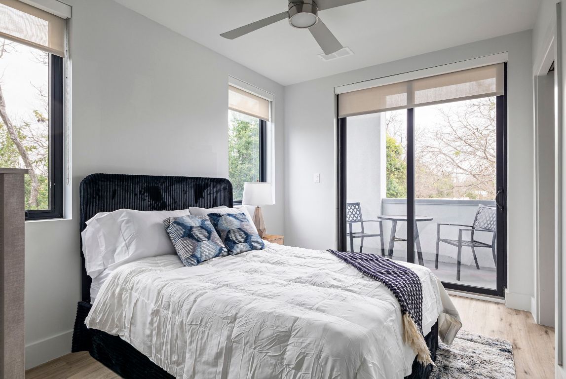 5515 Humming Bird Lane, Unit 207 Austin, TX 78745 - Photo 7 of 32 a bedroom with a large bed and a window