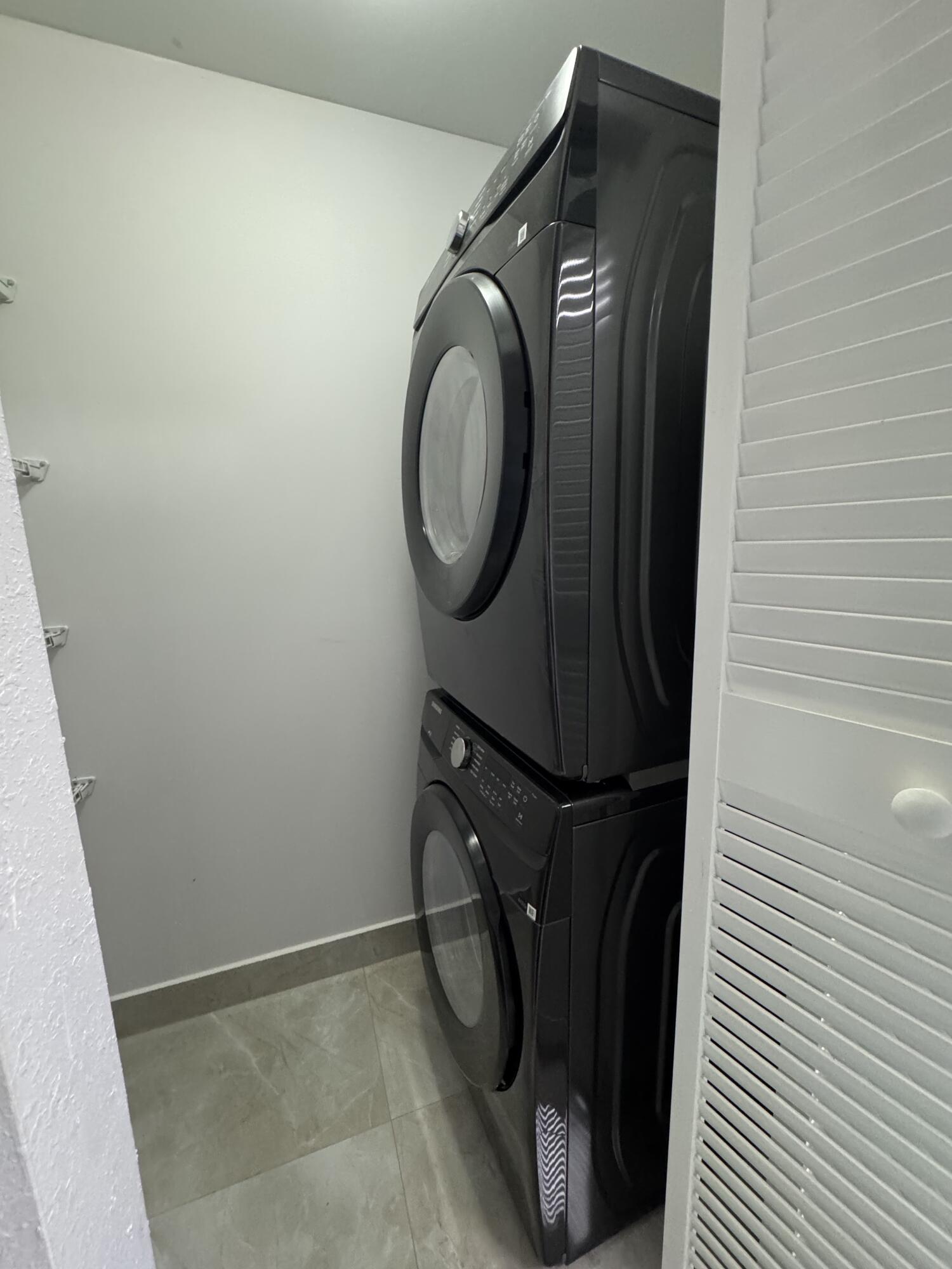 400 Northeast 30th Street, Unit 2 Pompano Beach, FL 33064 - Photo 21 of 22 a close view of utility room with washer and dryer