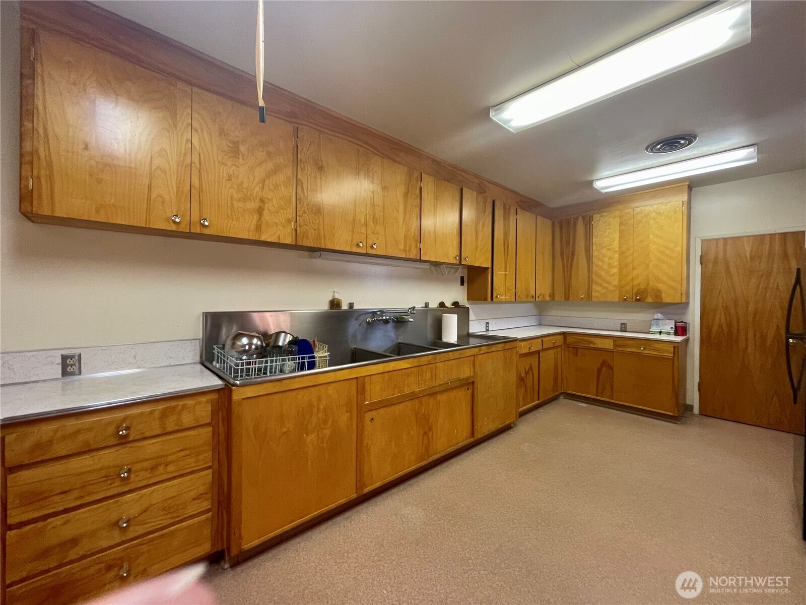 138 Range Street Hartline, WA 99135 - Photo 20 of 34 a kitchen with granite countertop a sink cabinets and stainless steel appliances