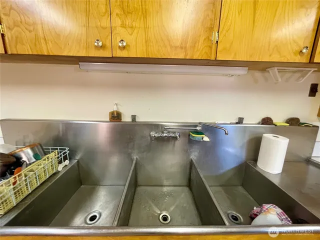 a kitchen with a refrigerator and a stove